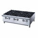 a stainless steel stove with four burners