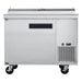 a large stainless steel freezer sitting on wheels