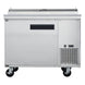 a large stainless steel freezer sitting on wheels