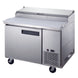 a stainless steel counter with two doors and two drawers