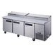 a stainless steel counter with three doors and two drawers