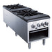 a black and silver stove top oven with four burners