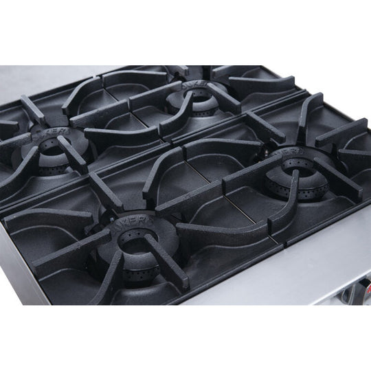 a close up of a gas stove with four burners