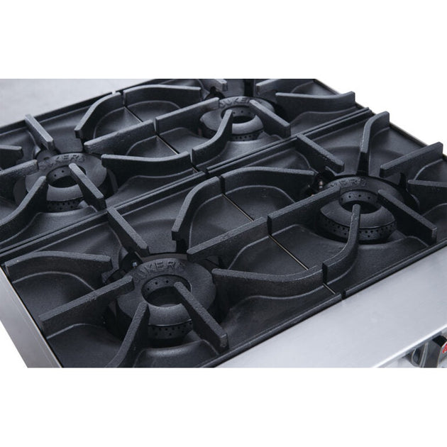 a close up of a gas stove with four burners