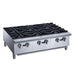 a stainless steel stove top with four burners